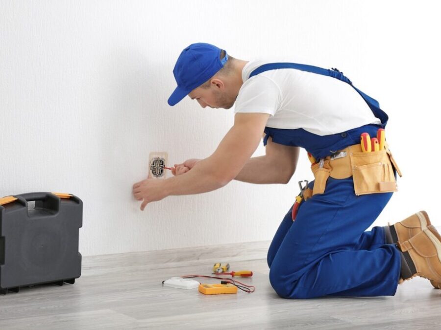 A Man Opening a Duct in the Wall