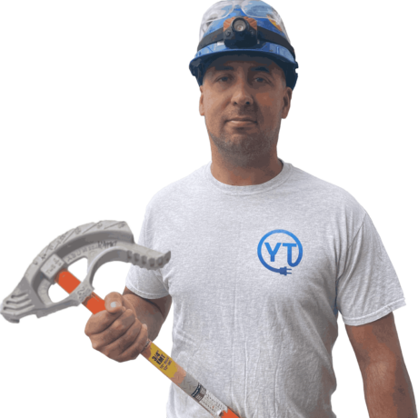 An electrician carrying a tool